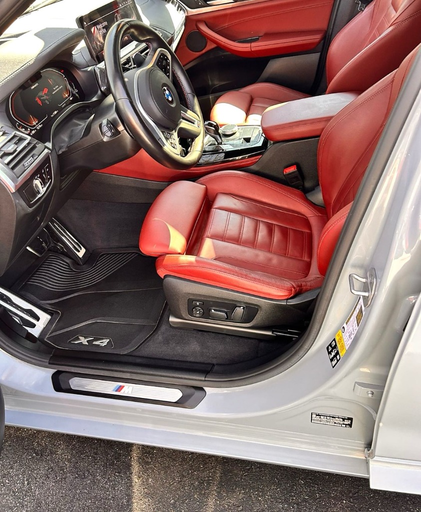 Immaculate red leather seats after deep clean and UV protectant conditioning in Kaysville Utah