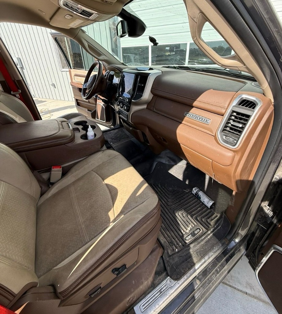 Dusty work truck interior with dirty floor mats before fleet interior steam cleaning in Roy UT
